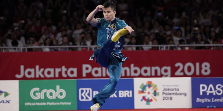 JUARA DUNIA. Atlet wushu Indonesia Edgar Xavier Marvelo saat tampil di Asian Games 2018 Jakarta, tahun lalu. Edgar tampil sebagai juara dunia usai merebut emas pada Kejuaraan Dunia 2019 yang berlangsung di Tiongkok, Senin (21/10). (MEDIA INDONESIA/ROMMY PUJIANTO)
