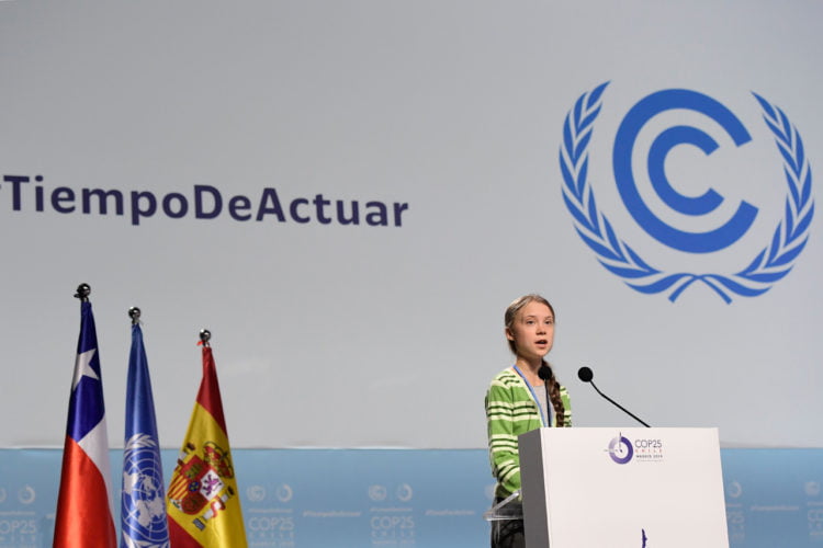 Aktivis iklim Swedia Greta Thunberg memberikan pidato selama acara tingkat tinggi tentang darurat iklim yang diselenggarakan presiden Cile selama COP25 Konferensi Perubahan Iklim PBB di pusat pameran IFEMA-Feria de Madrid, di Madrid, pada 11 Desember 2019. Thunberg dianugerahi Person of the Year 2019 oleh Majalah Time.(CRISTINA QUICLERAFP/AFP)