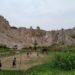 GUNUNG KUNYIT. Anak-anak bermain sepak bola di lapangan tepat di bawah Gunung Kunyit, Kecamatan Bumiwaras, Bandar Lampung, Selasa (3/12). Warga sekitar tidak merasa khawatir walau sering terjadi longsoran.(LAMPUNG POST/SUKISNO)
