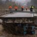 Sebuah jembatan terputus akibat banjir yang dipicu badai Gloria di Spanyol. Foto: AFP