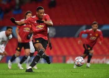Manchester United's French striker Anthony Martial shoots from the penalty spot to score his team's fourth goal during the UEFA Champions league group H football match between Manchester United and RB Leipzig at Old Trafford stadium in Manchester, north west England, on October 28, 2020. (Photo by Anthony Devlin / AFP)