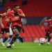 Manchester United's French striker Anthony Martial shoots from the penalty spot to score his team's fourth goal during the UEFA Champions league group H football match between Manchester United and RB Leipzig at Old Trafford stadium in Manchester, north west England, on October 28, 2020. (Photo by Anthony Devlin / AFP)
