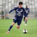 BORDEAUX VS OLYMPIQUE LYON. Penyerang Bordeaux Ui-Jo Hwang berlari dengan bola saat pertandingan Liga Prancis antara Nimes Olympique dan Olympique Lyonnais di Stadion Costieres, Nimes, Prancis, Senin (17/5).
AFP/ROMAIN PERROCHEAU