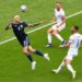 Scotland's forward Lyndon Dykes (L) heads the ball during the UEFA EURO 2020 Group D football match between Scotland and Czech Republic at Hampden Park in Glasgow on June 14, 2021. (Photo by ANDY BUCHANAN / POOL / AFP)