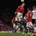 TOPSHOT - Manchester United's Portuguese striker Cristiano Ronaldo jumps to header the ball during the UEFA Champions league group F football match between Manchester United and Atalanta at Old Trafford stadium in Manchester, north west England, on October 20, 2021. - Manchester United won the match 3-2. (Photo by Paul ELLIS / AFP)