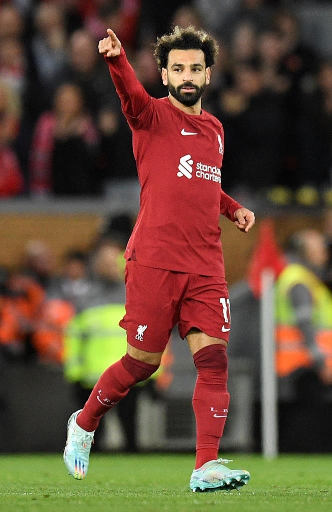 Liverpool's Egyptian striker Mohamed Salah celebrates scoring his team's first goal during the English Premier League football match between Liverpool and Leeds United at Anfield in Liverpool, north west England on October 29, 2022. (Photo by Oli SCARFF / AFP) / RESTRICTED TO EDITORIAL USE. No use with unauthorized audio, video, data, fixture lists, club/league logos or 'live' services. Online in-match use limited to 120 images. An additional 40 images may be used in extra time. No video emulation. Social media in-match use limited to 120 images. An additional 40 images may be used in extra time. No use in betting publications, games or single club/league/player publications. /