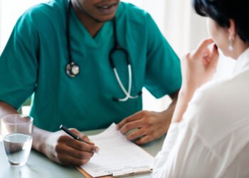 Doctor diagnose patient symptoms at the hospital