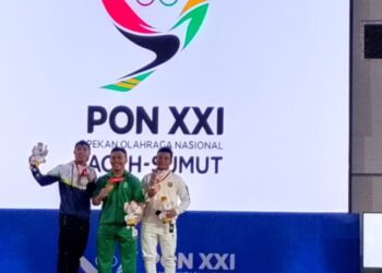 RAIH PERUNGGU. Pertandingan angkat besi PON XXI Aceh-Sumut 2024 kategori putra 67 kg. Atlet angkat besi Lampung menambah pundi medali dengan meraih perunggu di kelas 67 kg oleh lifter Harjianto di PON XXI 2024, Kamis (5/9). (Dok. KONI Lampung)