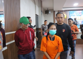 Pelaku pembuat laporan palsu saat berada di Mapolresta Bandar Lampung. Dok