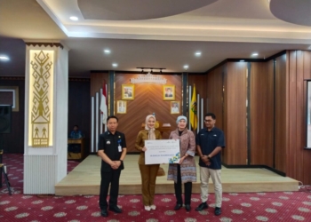 Pelepasan Purnabakti Kepala Dinas Emilia Kusumawati di Ruang Abung, Gedung Balai Keratun, Selasa, 1 Juli 2025. (Foto: Lampost.co / Atika)