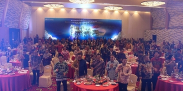 Pertemuan Tahunan Bank Indonesia (PTBI) 2025 dengan tema “Tangguh Mandiri: Sinergi Mendorong Pertumbuhan Ekonomi Lebih Tinggi dan Berdaya Tahan”. Acara berlangsung di Ballroom Hotel Novotel Lampung pada Jumat, 28 November 2025, dan terhubung secara daring dengan agenda serupa di Kantor Pusat BI, Jakarta. Rifki/Lampost.co