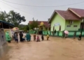 Hujan deras dengan intensitas tinggi yang mengguyur wilayah Kabupaten Pringsewu, Kamis (12/02/2016) menyebabkan banjir.